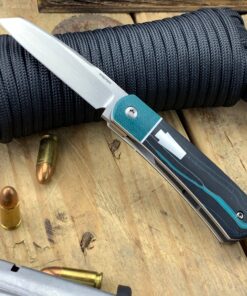 Enrique Pena Front Flipper Apache with Greg Hanson Micarta Handles with White G10 Bolsters