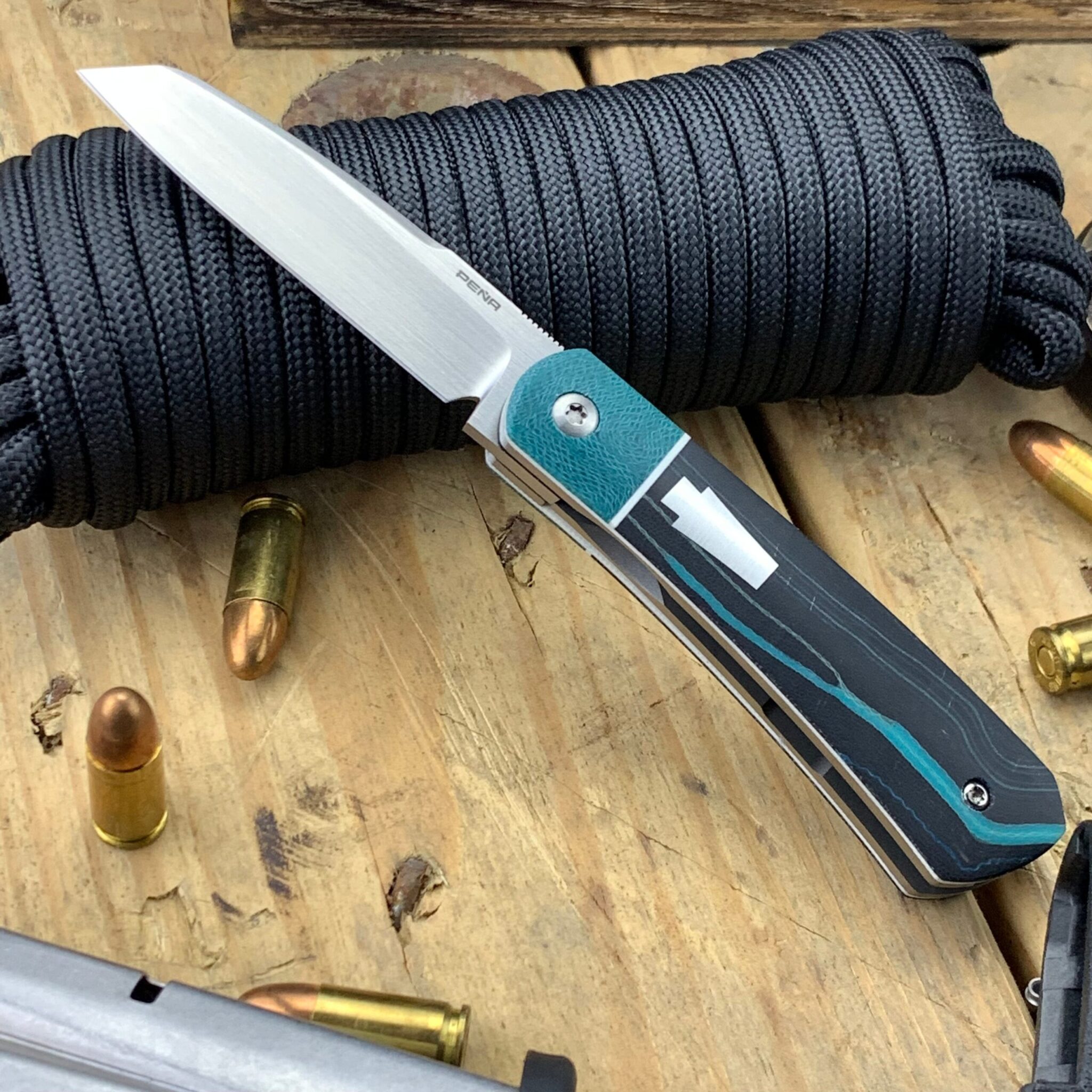 Enrique Pena Front Flipper Apache with Greg Hanson Micarta Handles with White G10 Bolsters